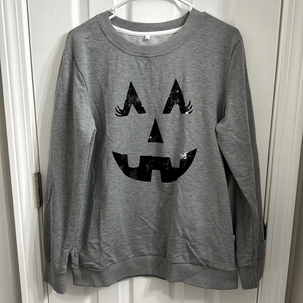Brand new women’s Halloween sweatshirt size large.